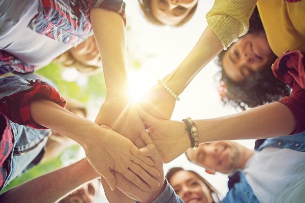 Group of people holding hands showing togetherness
